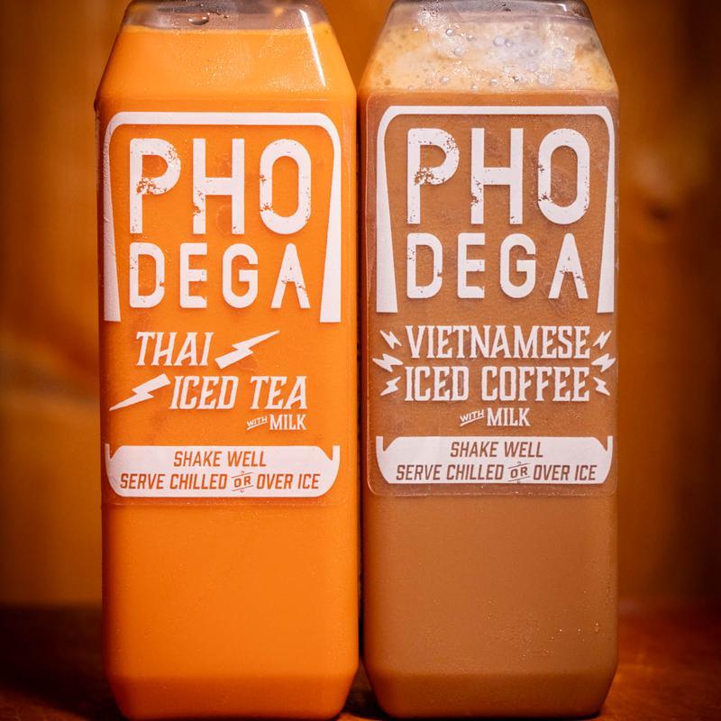 Two bottled iced drinks labeled "Thai Iced Tea" and "Vietnamese Iced Coffee