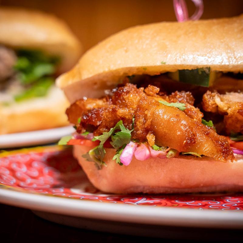 Crispy fried fish sandwich with pickled cabbage and cilantro