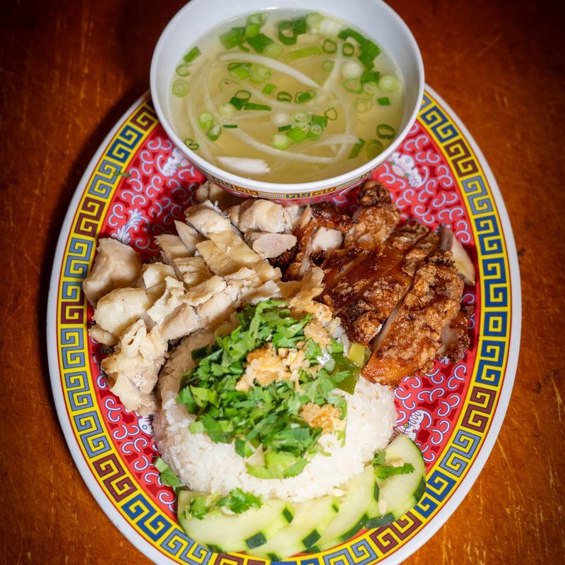 Hainanese chicken rice with poached and fried chicken, cucumber, clear soup